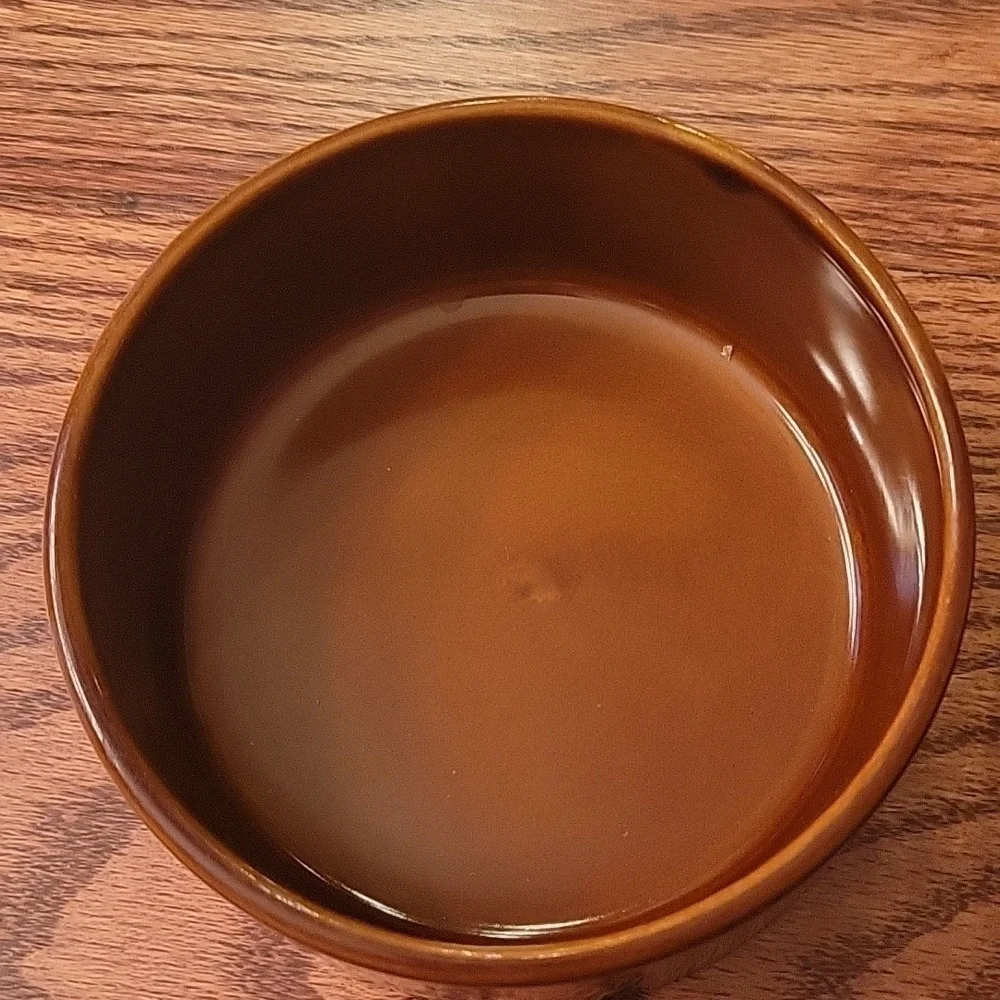 Two dark brown ceramic stoneware dog bowls.  5